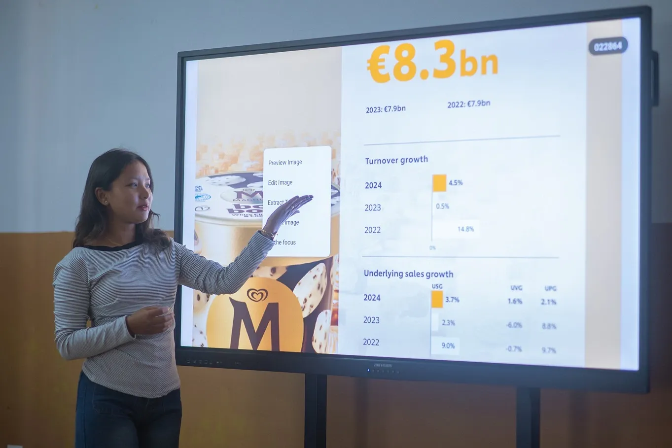 A girl presenting some design in a computer screen