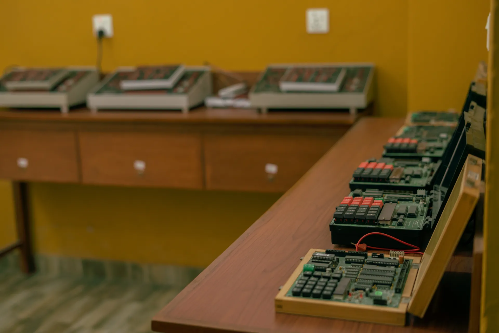 Student configuring wires around digital device