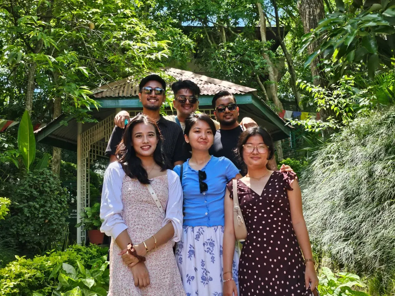 A lot of students with teacher infront of telecome building