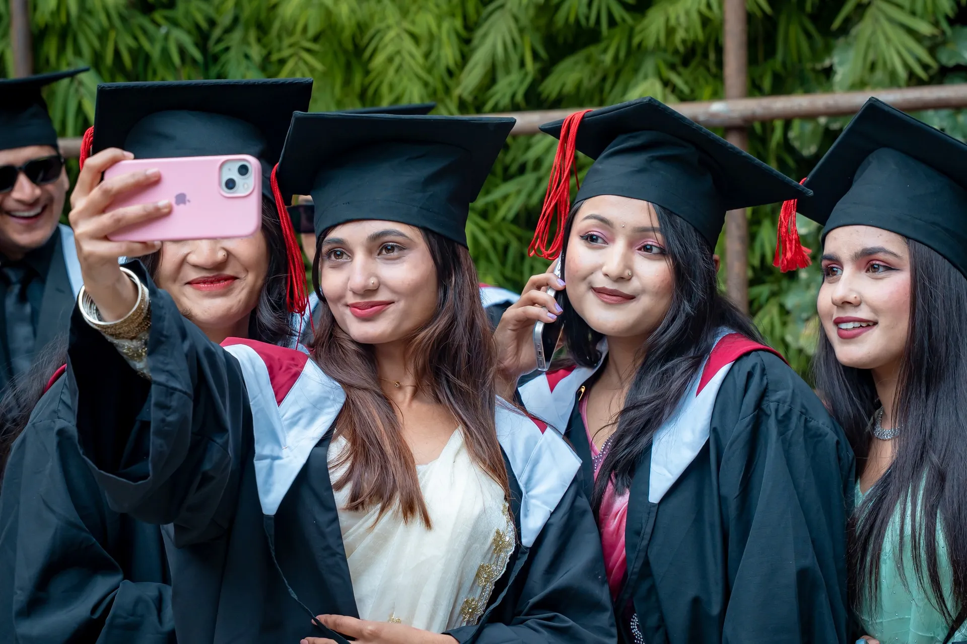 Girls are taking selfie on graduation day
