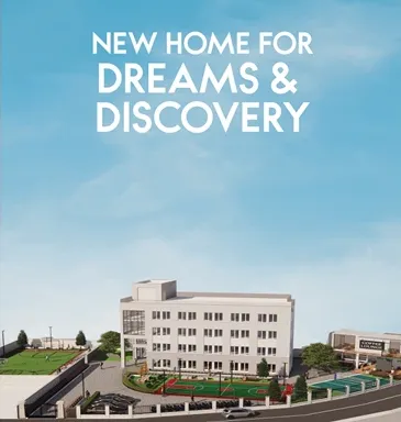 model of building with playground, parking